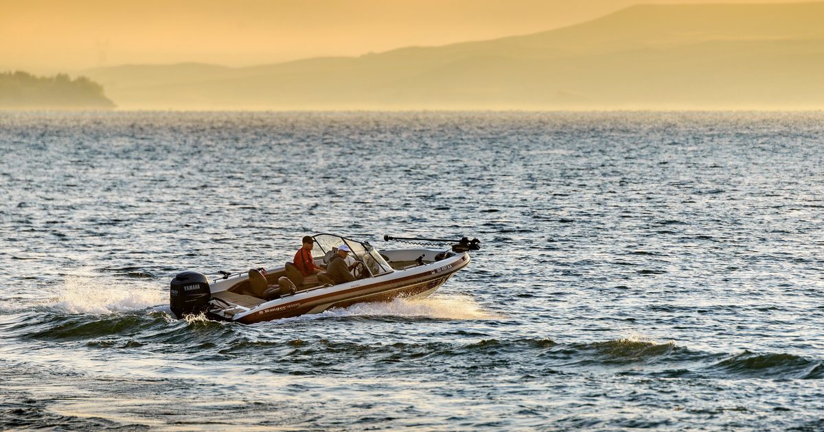 Two men on a boat on the water